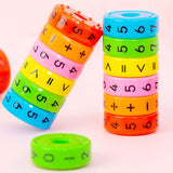 colorful blocks attached magnetically in the shape of a cylinder with mathematical numbers and symbols on it.