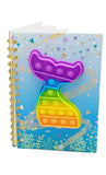 mermaid tail 3d multicolor pop it toy on a spiral ring binded notebook